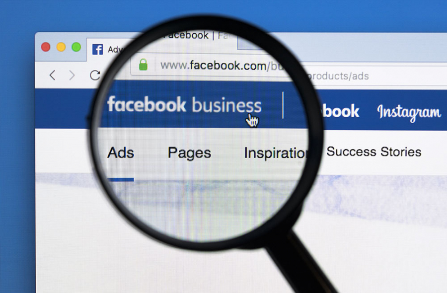 Facebook business in browser and Magnifying glass. It shows how Facebook helps you to be found by your customers and highlights the importance of social media and relevance score for your business.