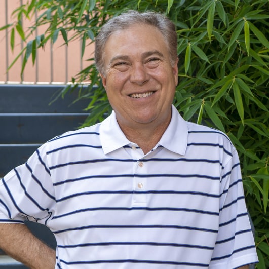 Steve Herber - founder and owner of LeadDog DigitalTyler, TX, is sitting in front of a plant.