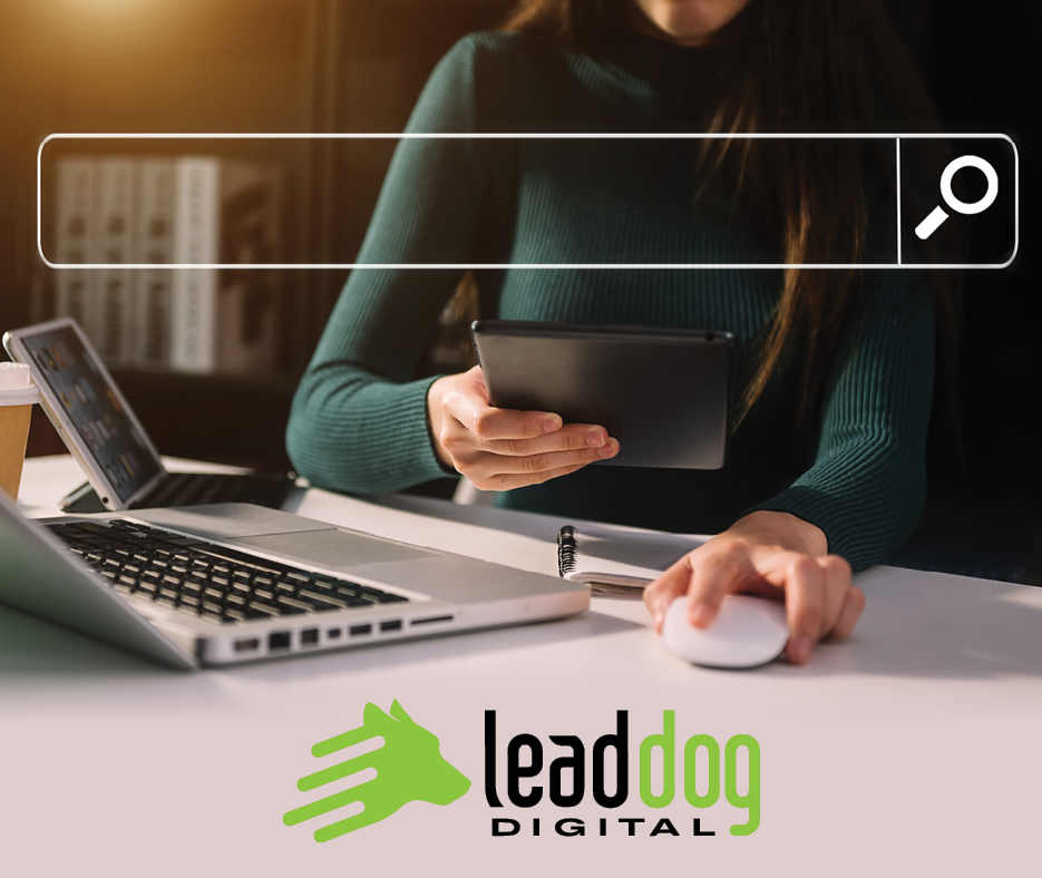 A girl with a laptop and tablet working for Lead Dog Digital in Tyler, TX - experts in SEO, digital marketing, and web design.